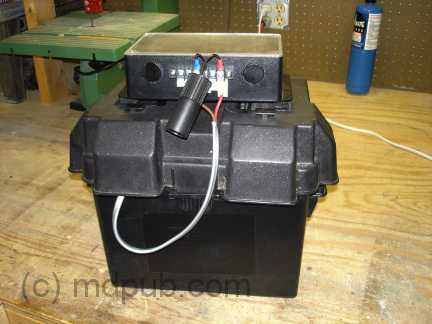 The charge controller mounted on a battery box.