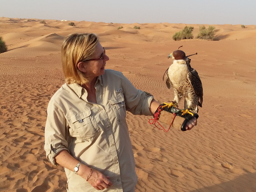 Leslie holding a falcon.