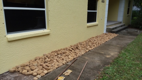 The rocks in place beside the house.