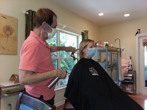 Leslie getting her hair styled at home.