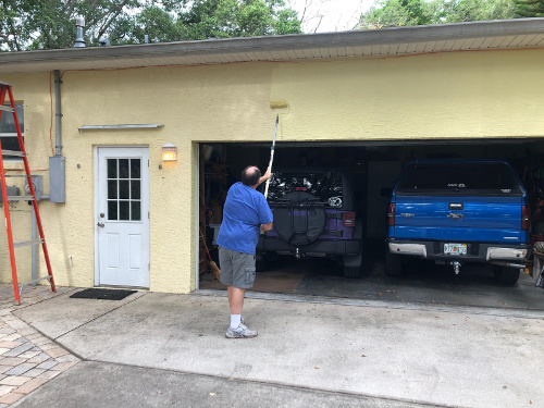 Me Painting the east side of the house.