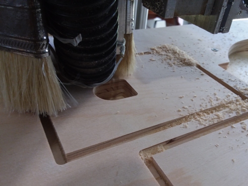 Cutting the adapter plate on a CNC Router.