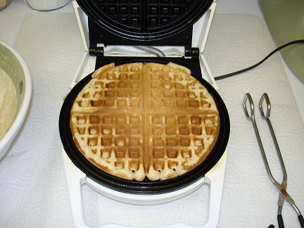 making waffles with a waffle iron