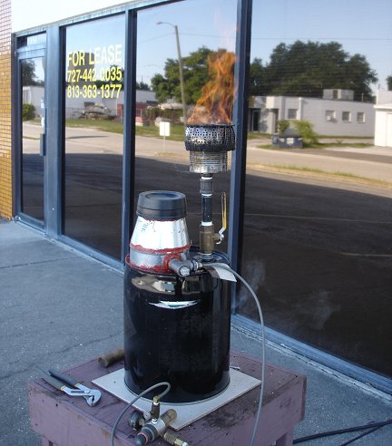 My home-made wood gasifier flaring gas.