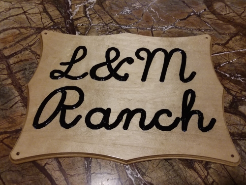 A carved wooden sign for our Wyoming ranch.