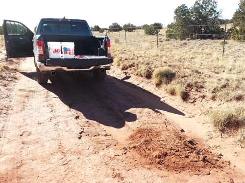 Fixing potholes in the road.