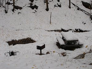 Snow covering an empty campground.