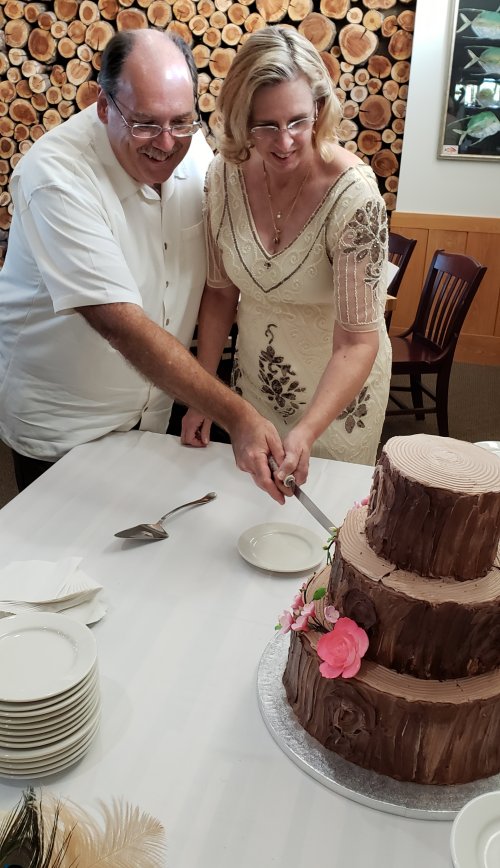 Cutting the wedding cake.