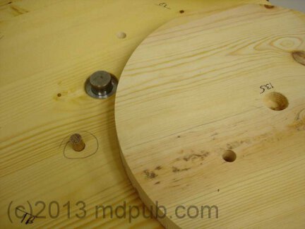Alignment holes in the trntable and wooden disks.