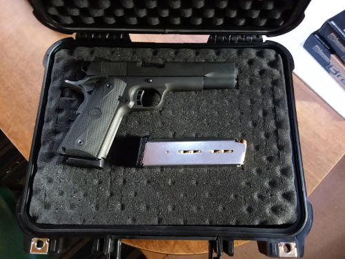 My new Rock Island Armory M1911-A1 FS in a case with a second magazine.