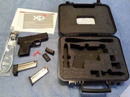 A new 9mm Springfield XDs and all its accessories.