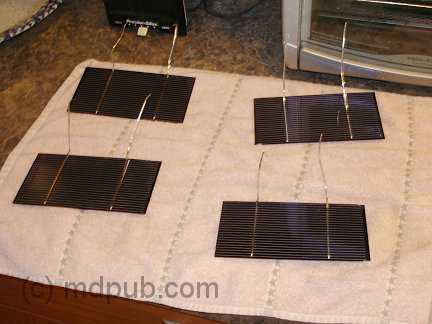 Cleaned solar cells drying on a towel