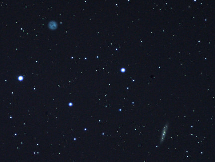 A photo of M97 (Owl Nebula) and M108.