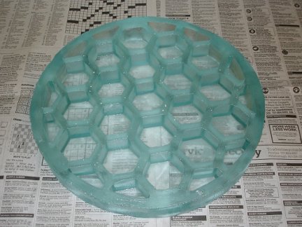 A finished honeycomb back telescope mirror blank.